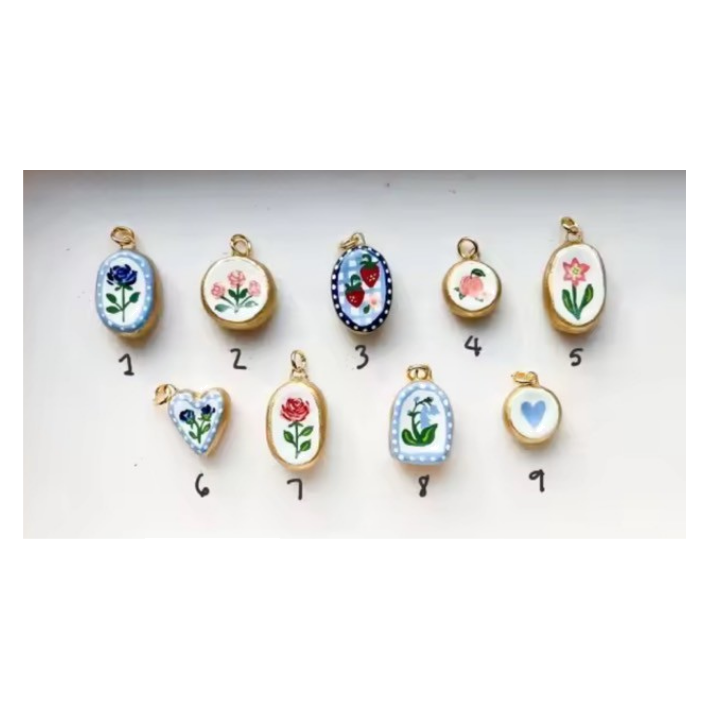 floral in oval 2 gold bezel charm