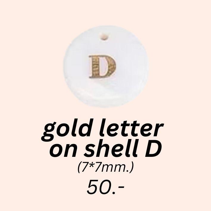 gold letter 
on shell D charm