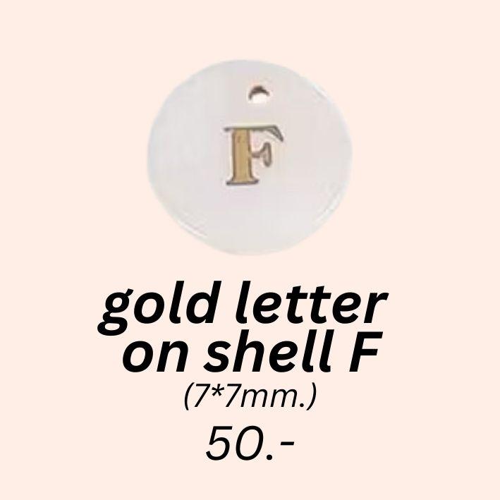 gold letter 
on shell f charm