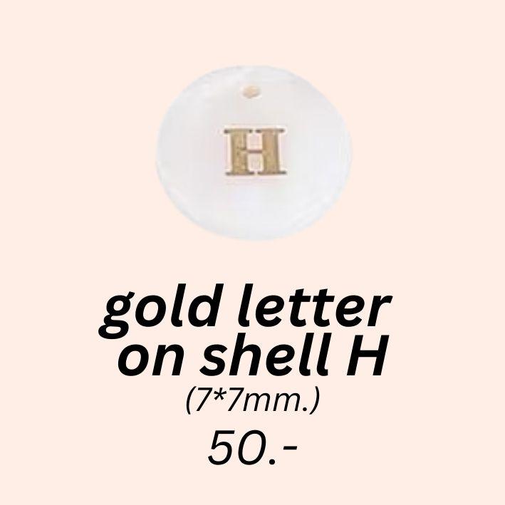 gold letter 
on shell h charm