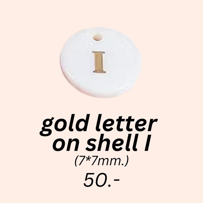 gold letter 
on shell I charm