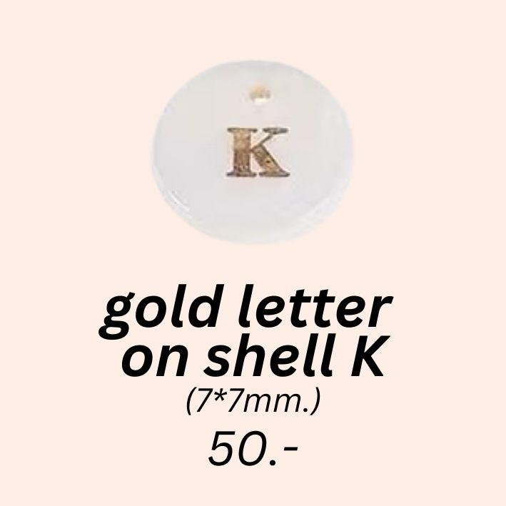 gold letter 
on shell K charm