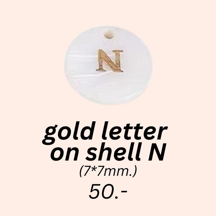 gold letter 
on shell N charm