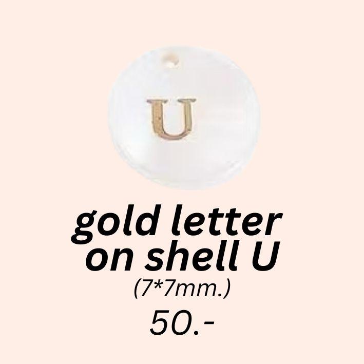 gold letter 
on shell U charm